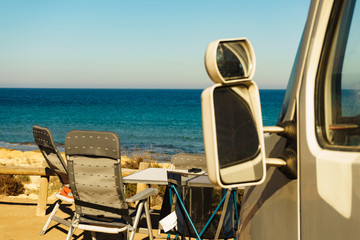 Tourist table and chair on seaside, camping.