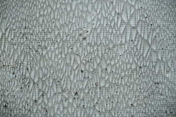 Concrete background with jagged pattern.