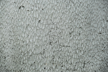 Concrete background with jagged pattern.