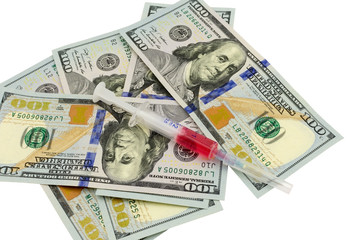 Money and syringe on isolated on white
