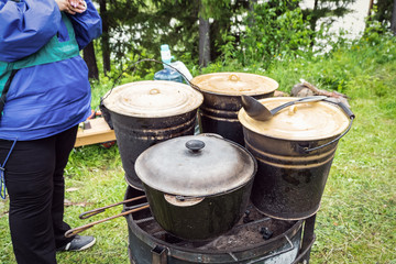 Charity outdoor food. Large pots of food.