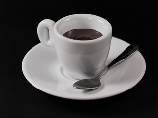 hot chocolate in a Cup on a black background