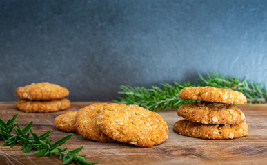 Freshly baked Anzac biscuits, an Australian tradition enjoyed on Anzac Day, made wth rolled oats and golden syrup, copy space