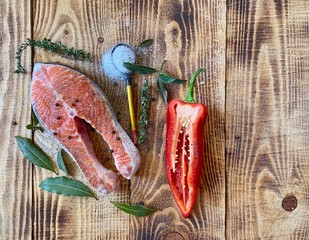 Fillet of pickled red fish on a wooden board. Seafood.