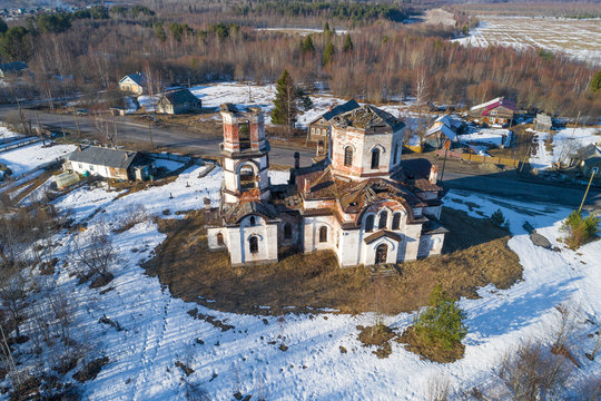 Old abandoned Rozhdestvenskaya church in the village of Verkhruchey on a April day (aerial photography). Karelia, Russia © sikaraha