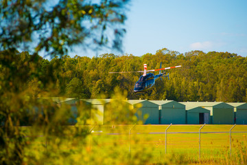 Fototapeta na wymiar A Helicopter getting ready to fly nearby Gold Coast in Queensland, Australia. Australia is a continent located in the south part of the earth.