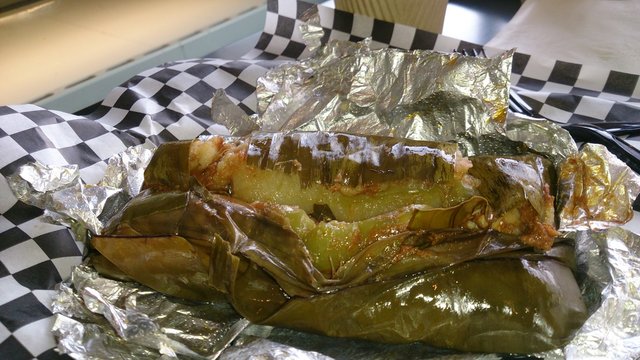 Salvadoran Tamale On Foil Paper On Table