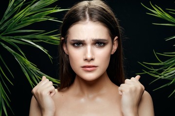 Fototapeta premium Pretty woman green leaves clean skin cosmetics
