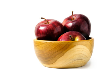 Group of red Apple above wooden bowl / basket isolated on white background