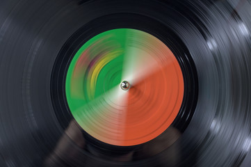 Closeup of a vinyl record spinning on a turntable