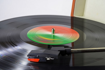 Closeup of a vinyl record spinning on a turntable