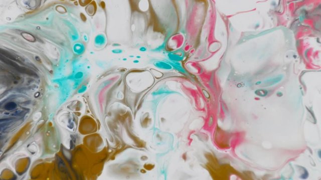 
spreading paint and mixing different colors. Colorful background with bubbles