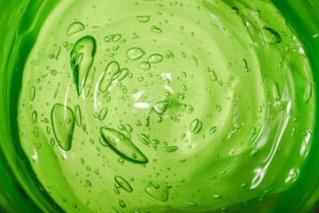 Aloe Vera cosmetic gel. Gel texture with bubbles on isolated white background. Concept of natural...