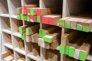 The stock of lumbers in a wood shelf. Detail of wood blocks in storage.