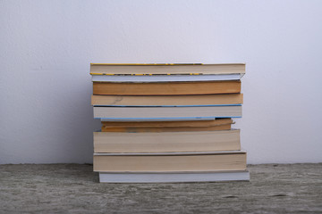 A bunch of books against white wall