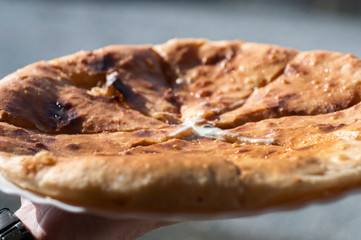 Caucasian khychin bread pie with meat close