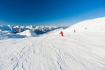 View down a piste in alpine ski resort