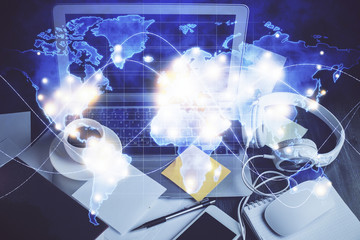 Double exposure of business theme icons and work space with computer background. Concept of success.