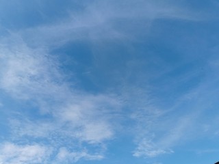 Fototapeta premium Blue sky background with white clouds