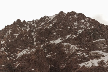 Snowy rocky mountain in Lo Valdés Valley, Cajón del Maipo, Central Andes of Chile.