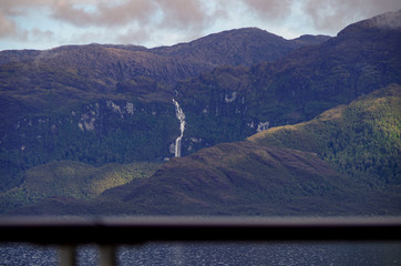 Impressive waterfalls and mountains with glaciers inside Chilean Fjords in Patagonia while cruising...