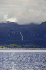 Impressive waterfalls and mountains with glaciers inside Chilean Fjords in Patagonia while cruising...