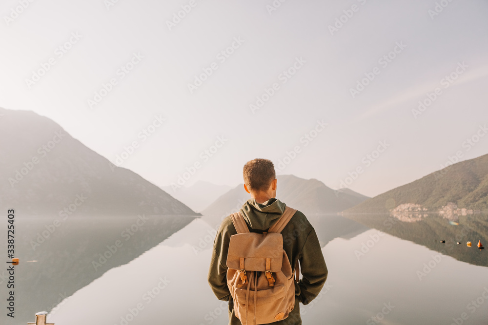 Wall mural backpack backside looks beautiful landscape travel people