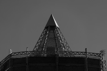 triangle metal roof top of a building and gray sky