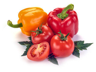 tomatoes and peppers with leaves on a white background