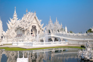 Unique white temple and popular tourist attraction in Chiang Rai (known as Wat Rong Khun) in the North of Thailand