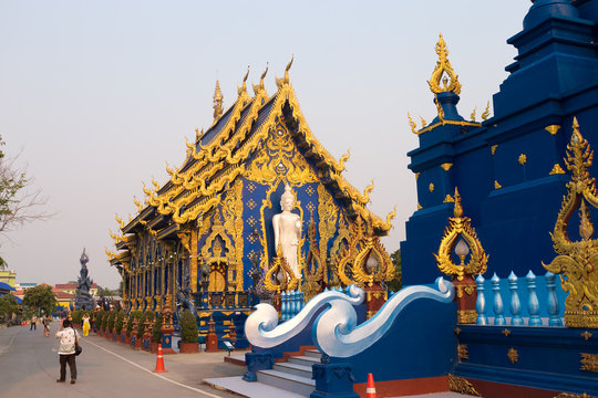 Famous Blue Temple in Chiang Rai Wat Rong Suea Ten in the North Thailand at the sunset time