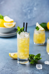 Fresh summer cocktail with lemons