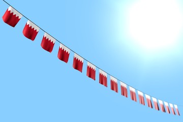 beautiful many Bahrain flags or banners hangs diagonal on rope on blue sky background with selective focus - any feast flag 3d illustration..