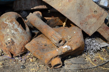 Various rusty details laying on the ground