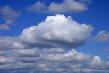 Fototapeta na wymiar dramatic fluffy clouds and blue azure sky background