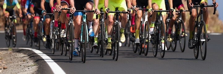 Cycling competition,cyclist athletes riding a race, the peloton climbing the mountain