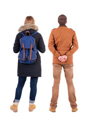 Back view of couple in winter jacket.