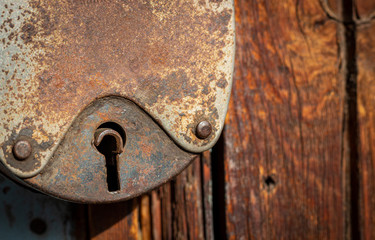 Keyhole on an old rusty padlock. 