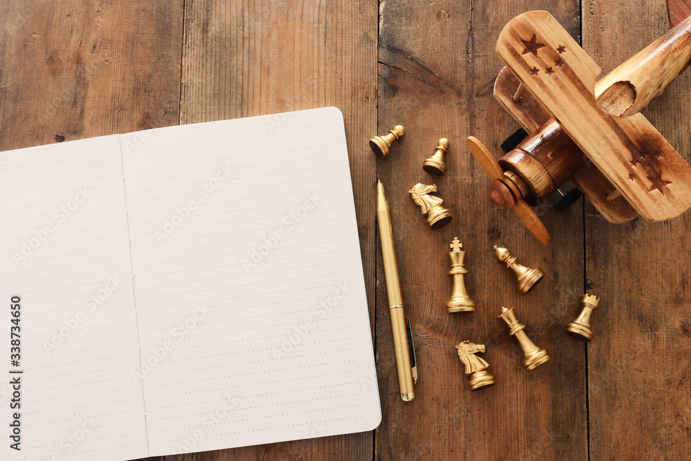 Fototapete top view image of open notebook with blank pages on wooden table. ready for adding text or mockup