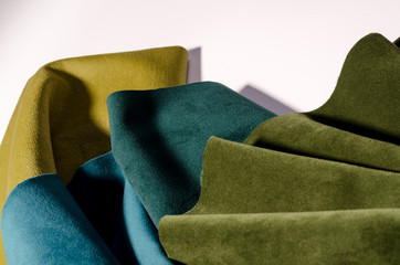 Bright collection of colorful velour textile samples. Fabric texture background