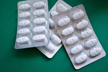 white painkillers,  pills and medications