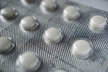 white painkillers,  pills and medications
