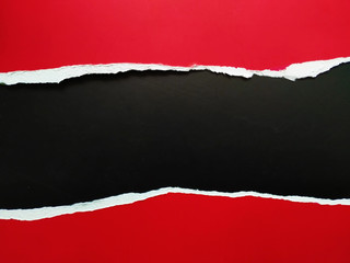 ripped paper on black background