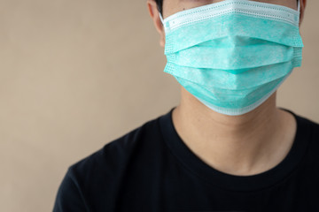 A young man wearing a protective medical mask. CORONA VIRUS concept.