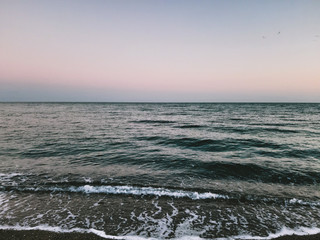 Obraz premium Genova, Italy - 04/14/2020: Old photography of the Ligurian seaside edited with basic programs from home during the COVID-19 outbreak.