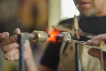 Concept of handmade, high quality, artisan. Production of neon tubes. gas burner. detail of craft and craftsmanship