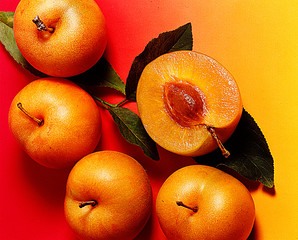 Apricot Tasty orange fruit with a kernel in it 
On an orange background