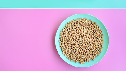 close up of soybeans on the green plate