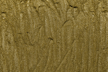 Detailed texture of glittering golden dust surface. Golden Shiny Wallpaper , Perfect for Christmas, New Year or any other Holidays Background. Golden fine powder