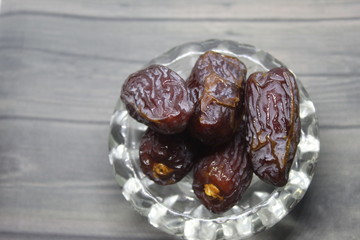 Sweet medjool dates with cup for ramadan kareem